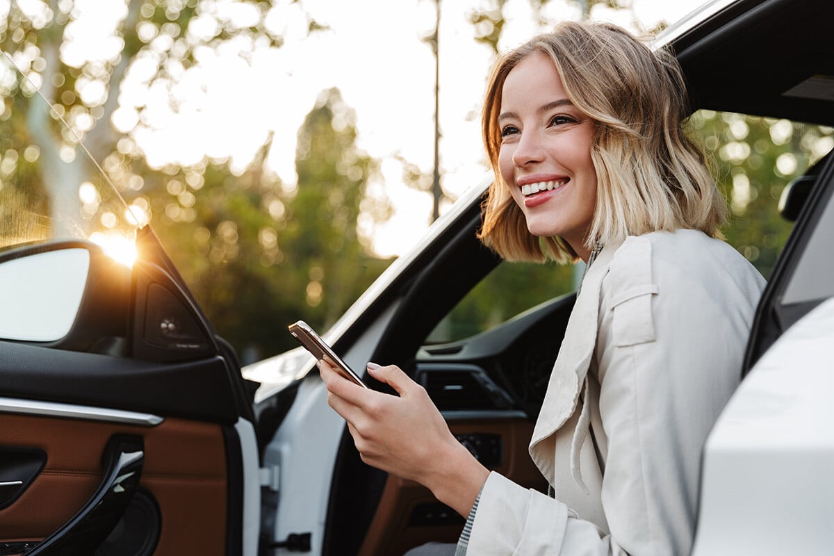 a person in a car using the phone